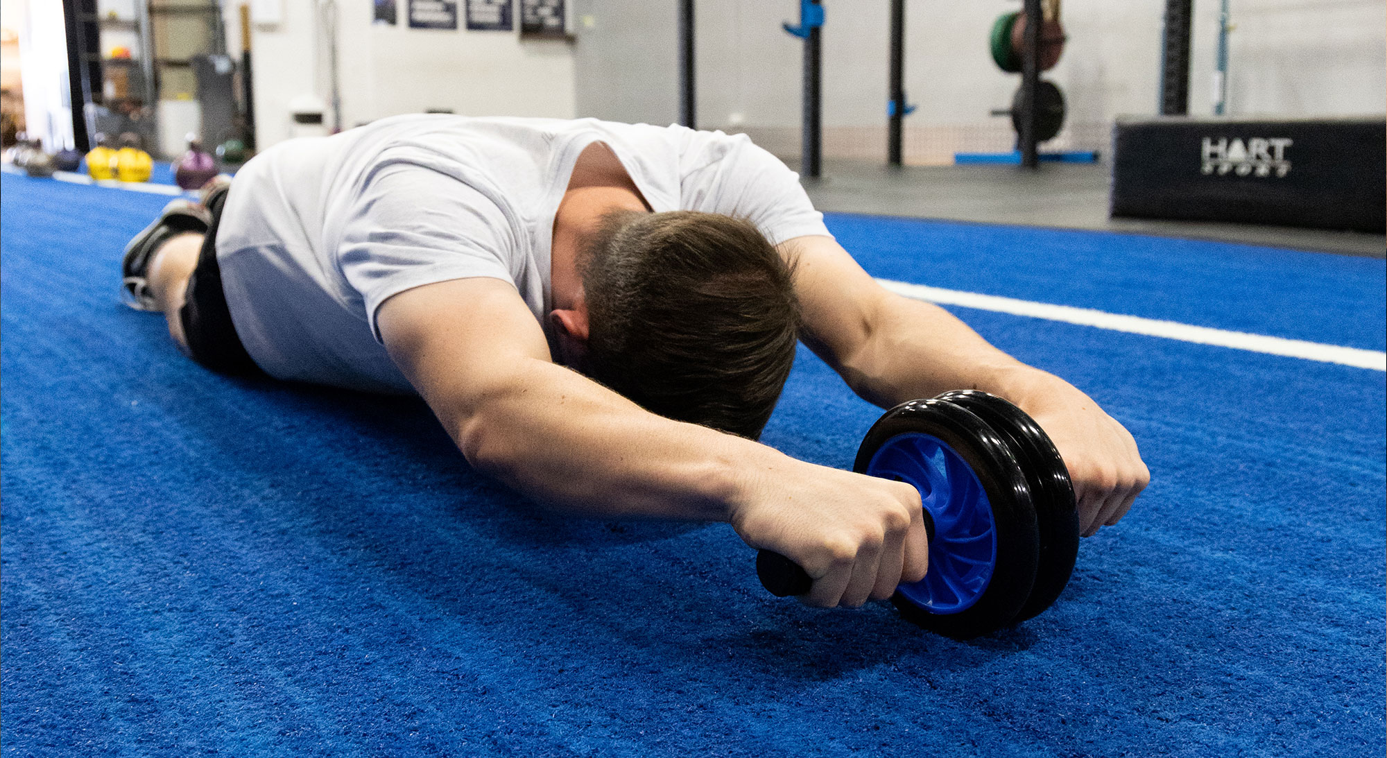 How to Do Kneeling Ab Wheel Roll-Out: Muscles Worked & Proper Form